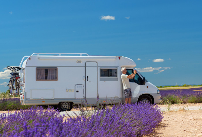 Traveler with mobile home at lavender fields in France