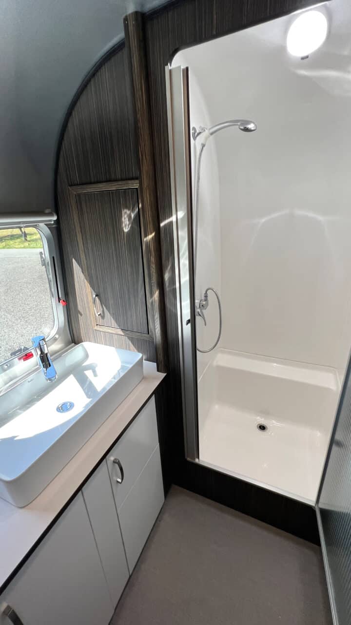 Innovations at Caravan Salon 2023: Airstream Germany presents luxury caravan with comfort bathroom and kitchen with oven 5 Airstream International 25IB Shower